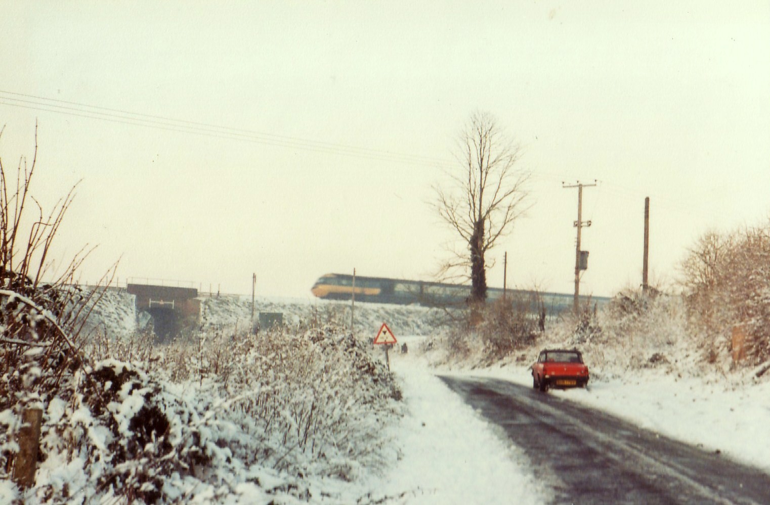 Snow scene with train in distance